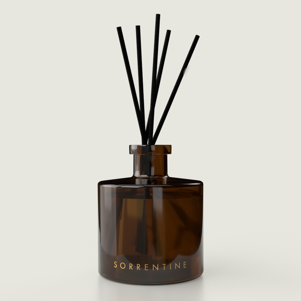 sorrentine reed diffuser by kymani in amber vessel and black reeds